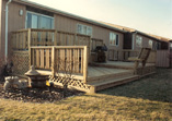 Three Level Deck with Triple Pickett Rail and Floating Bench with Back 