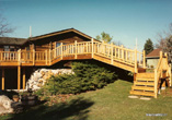 Bridge over Waterfall with Log Style Rail